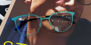 A pair of teal blue glasses from Orgreen eyewear