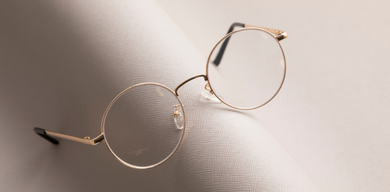 A pair of gold-plated, round thin frames