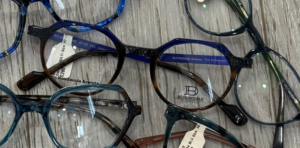 Selection of glasses with a focus on a pair of Bloomdale glasses