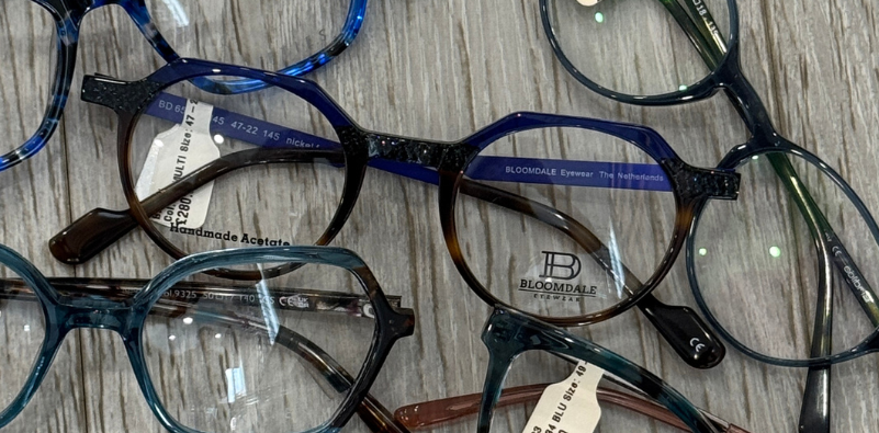 Selection of glasses with a focus on a pair of Bloomdale glasses