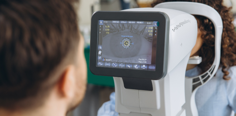 An optometrist performing an eye exam.