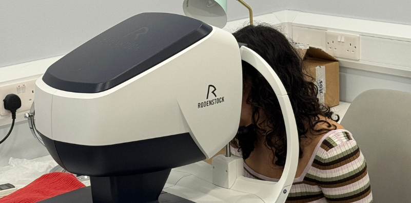 A woman having a DNEye scan at Mirage Opticians